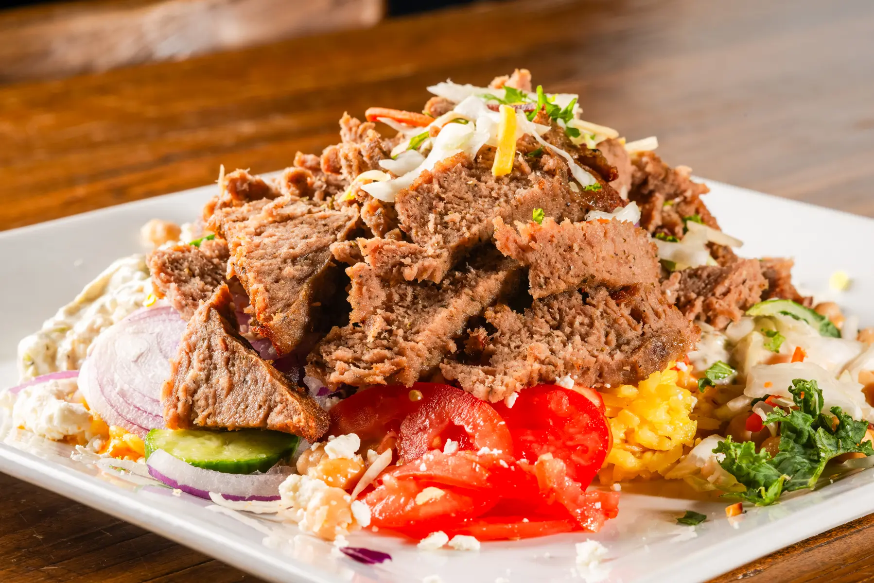 A plate of food with meat and vegetables on it.