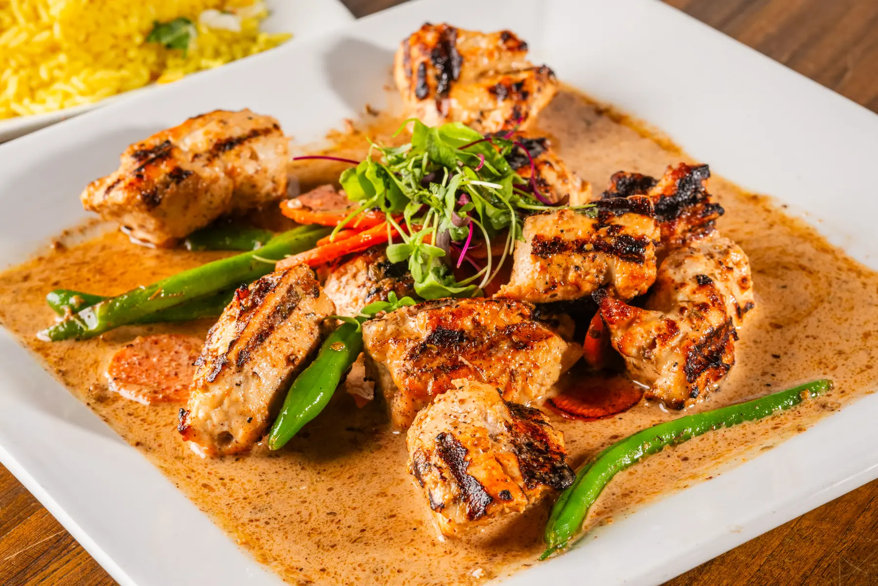 A plate of food with meat and vegetables on it.